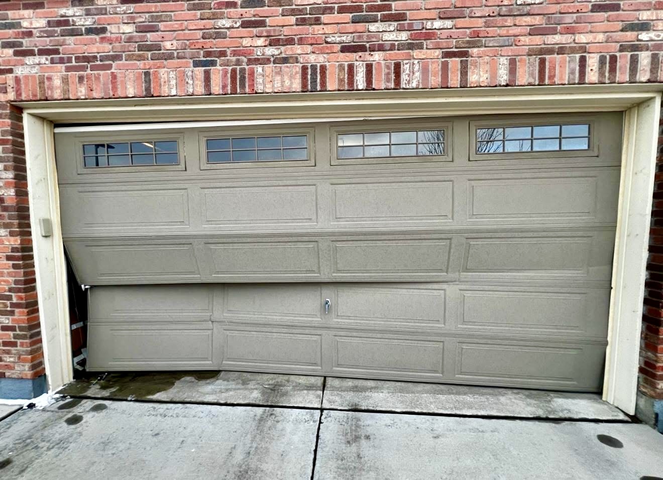 Damaged garage door viewed from outside