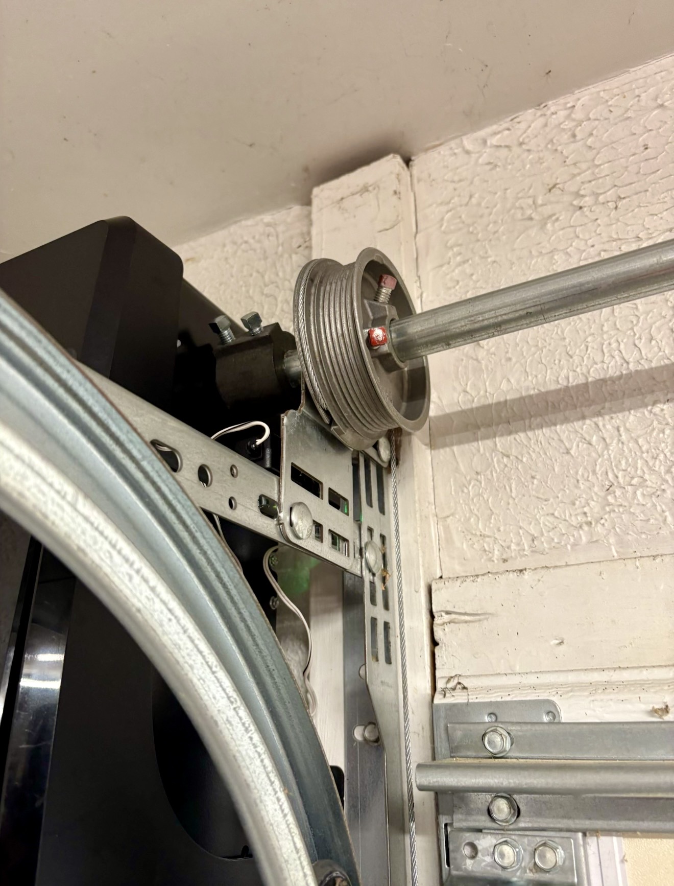 Garage door cable drum and cable hardware