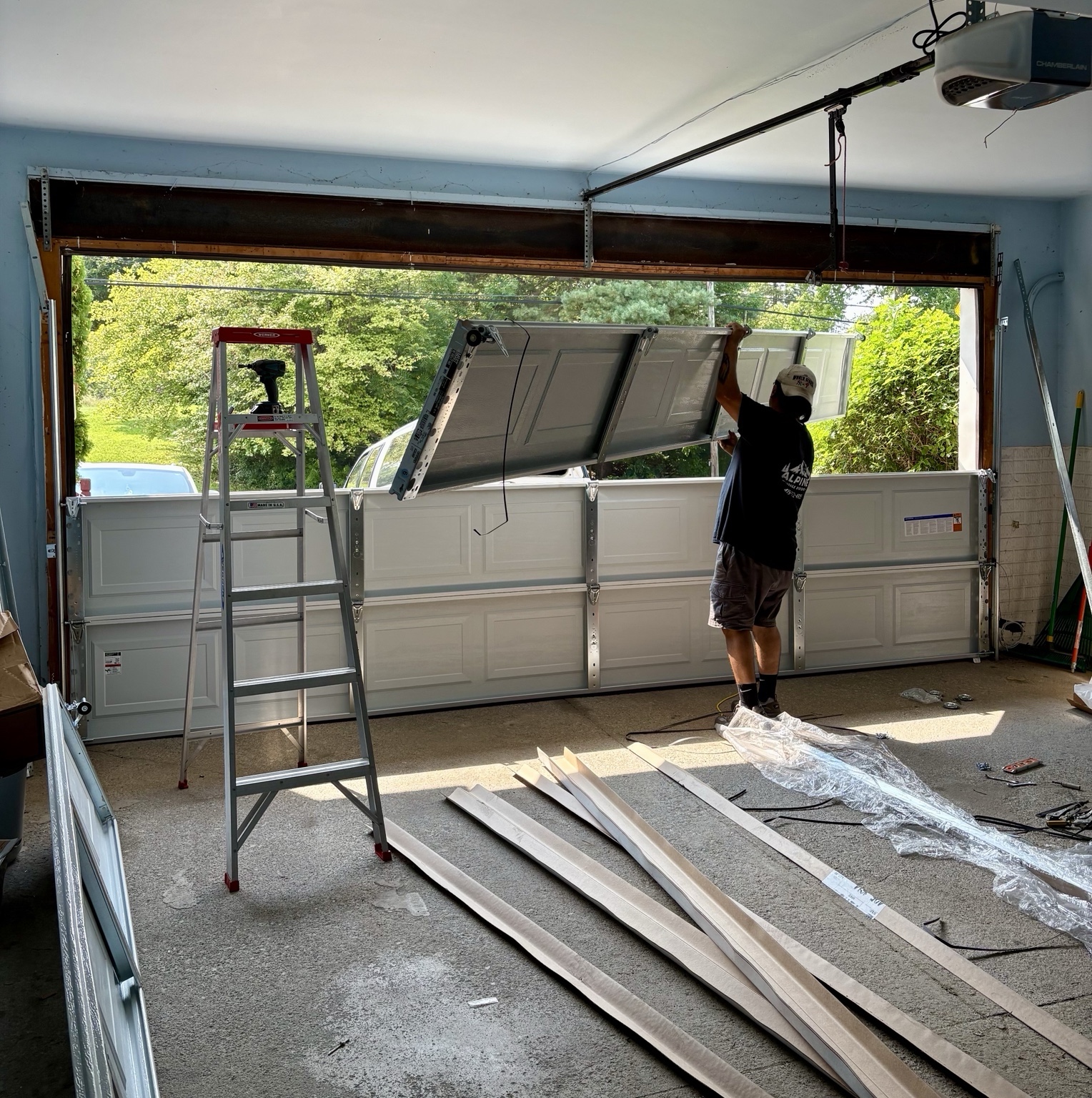 Daniel installing a residential garage door