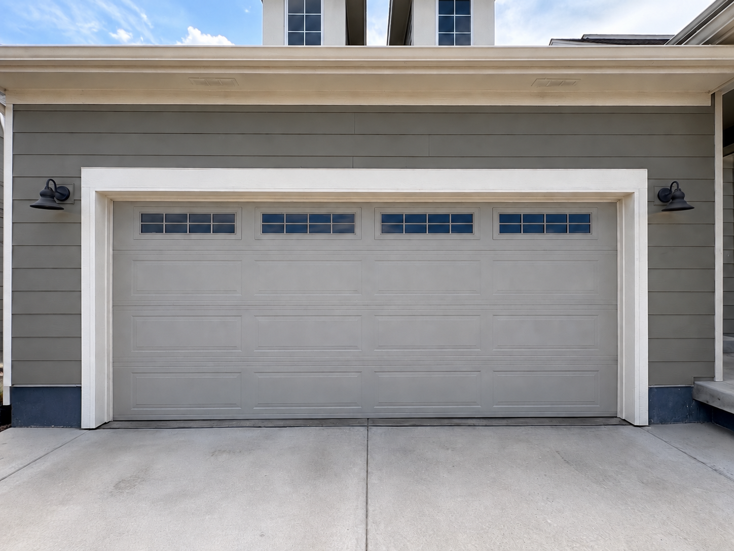 White windowed garage door on a gray Ohio home